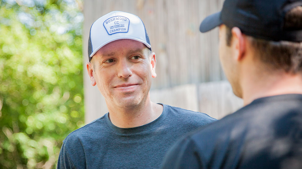 Two guys talking at NGLI opening retreat
