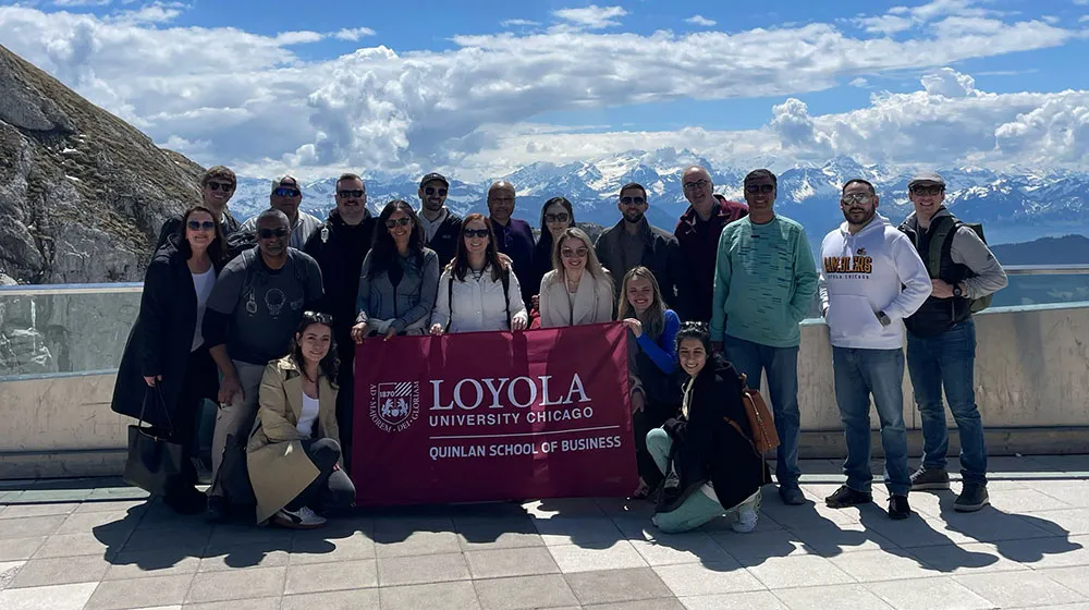 A group of students stand in Switzerland.
