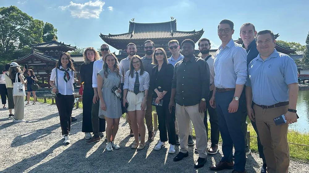 A group of EMBA students stand in Japan.