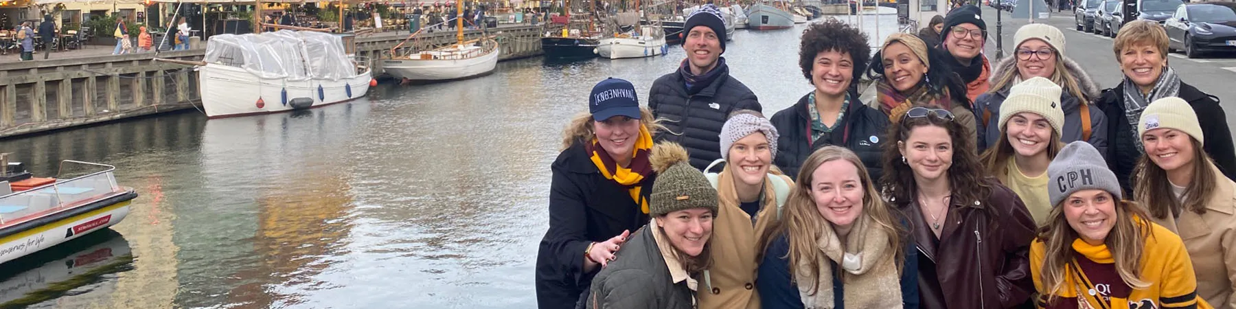Students gather near a Copenhagen canal