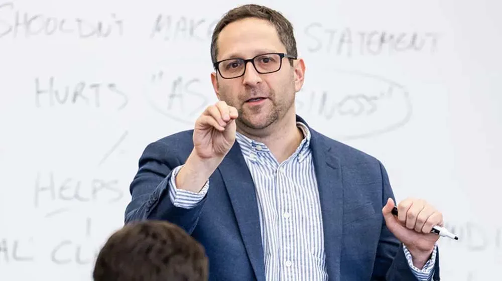 Professor Abe Singer lecturing in the classroom. Professor Abe Singer lecturing in the classroom.