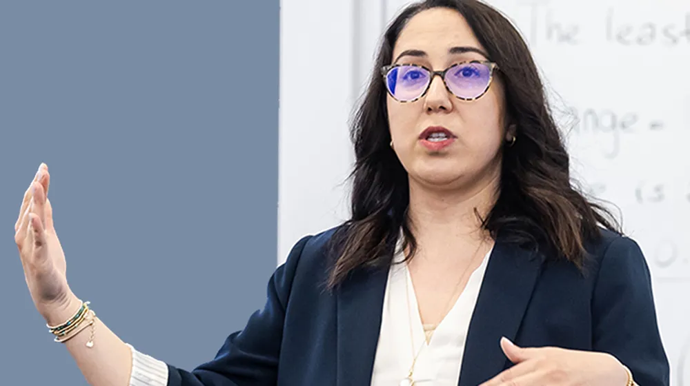 Irem Sengal Orgut engages with students as she teaches in the classroom.