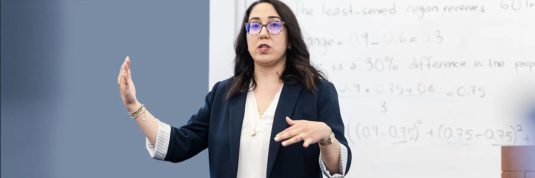 Irem Sengal Orgut engages with students as she teaches in the classroom.
