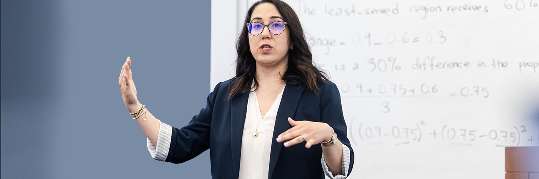 Irem Sengal Orgut engages with students as she teaches in the classroom.