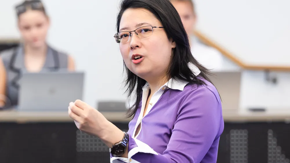 Zongfei Lisa Yang engages with students as she teaches in the classroom.