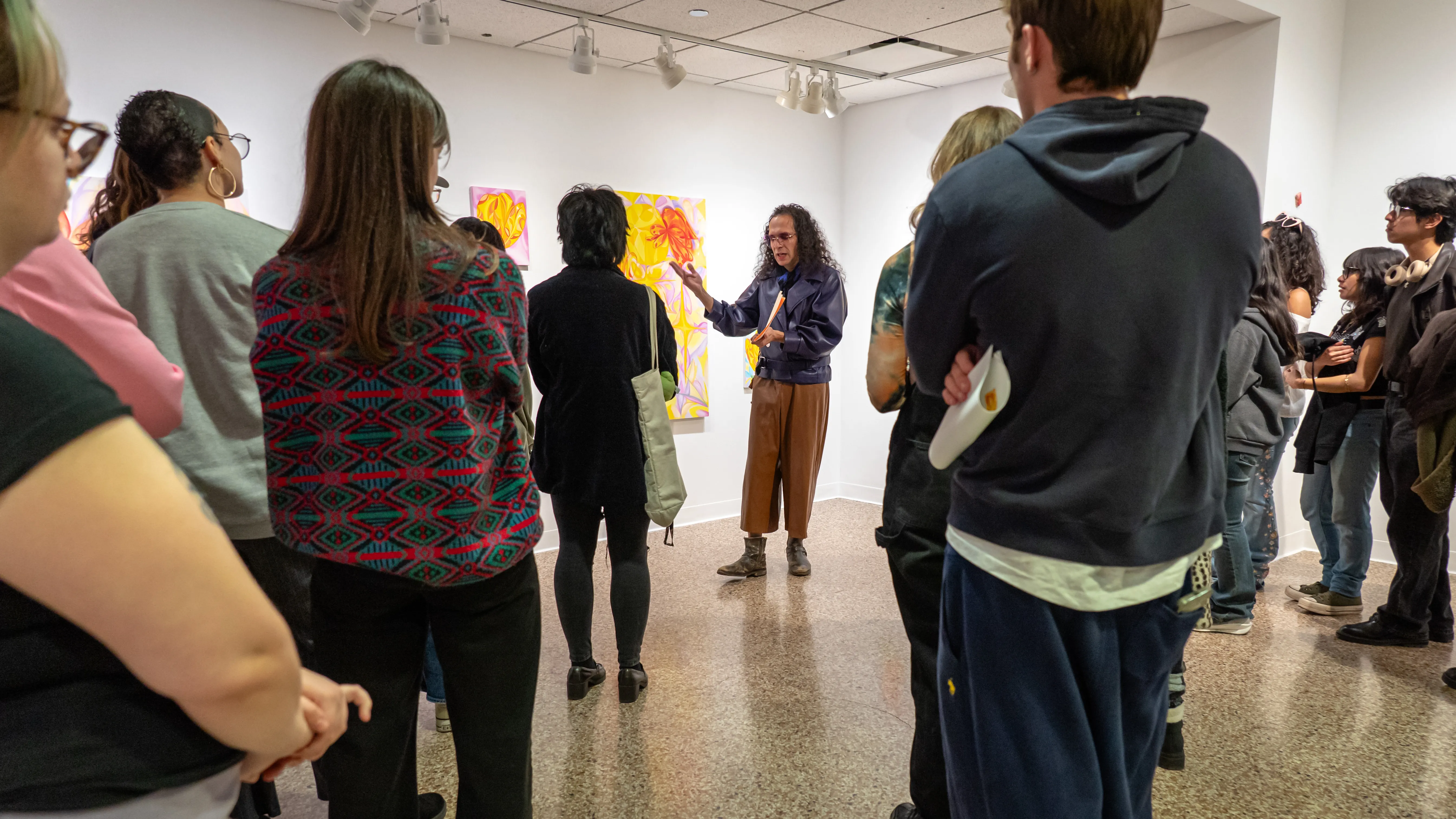 Flor Flores giving an artist talk in Ralph Arnold Gallery