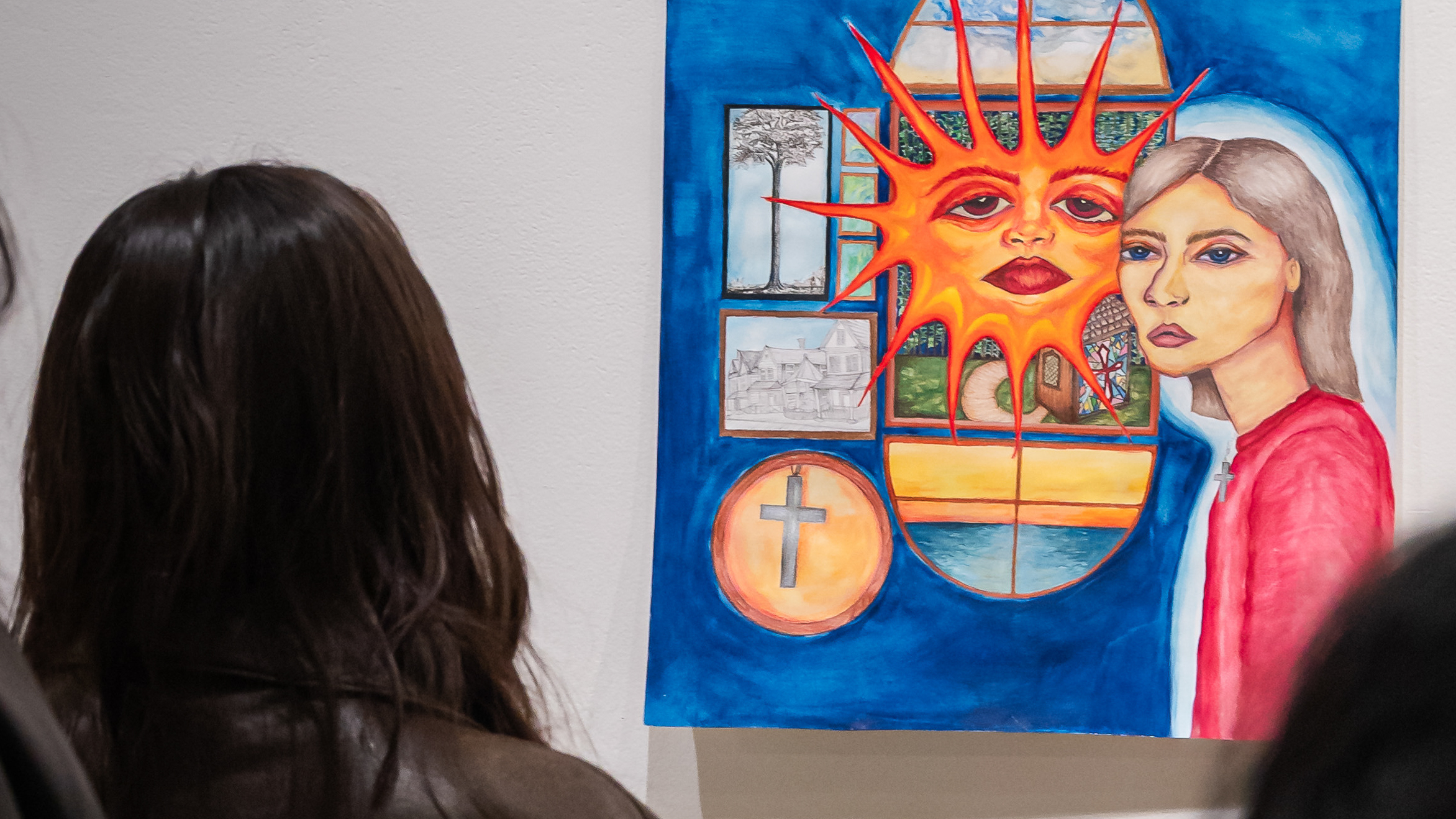Loyola student viewing a piece of art in Ralph Arnold Gallery