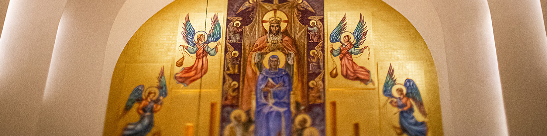 The wall mural behind the altar of Madonna della Strada that depicts Jesus, Mary, the apostles, and patriarchs of the faith surrounded by angels.