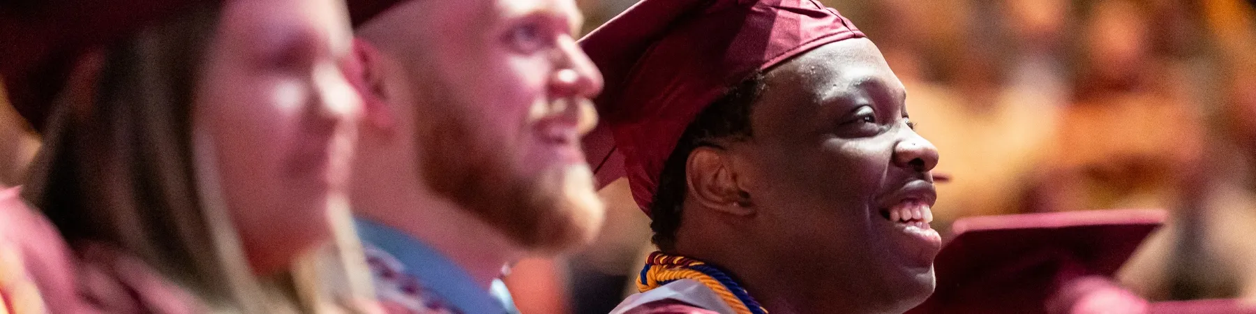 Loyola School of Continuing and Professional Studies graduates celebrating at commencement