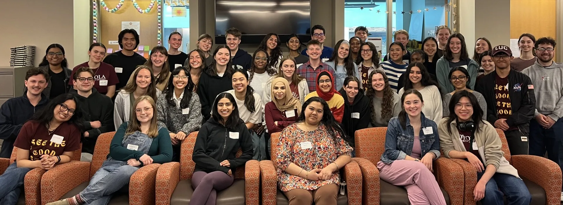 Large group of students smiling at the camera.