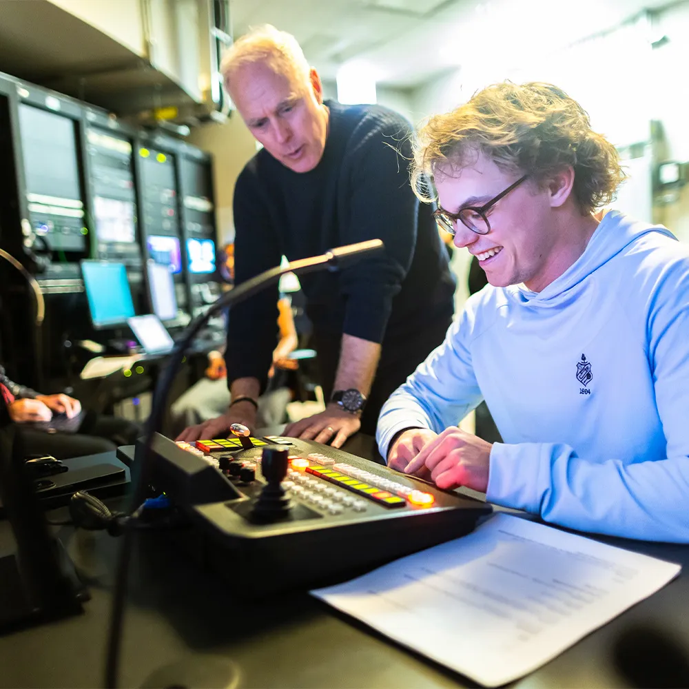 Students working together on a project at a table indoors