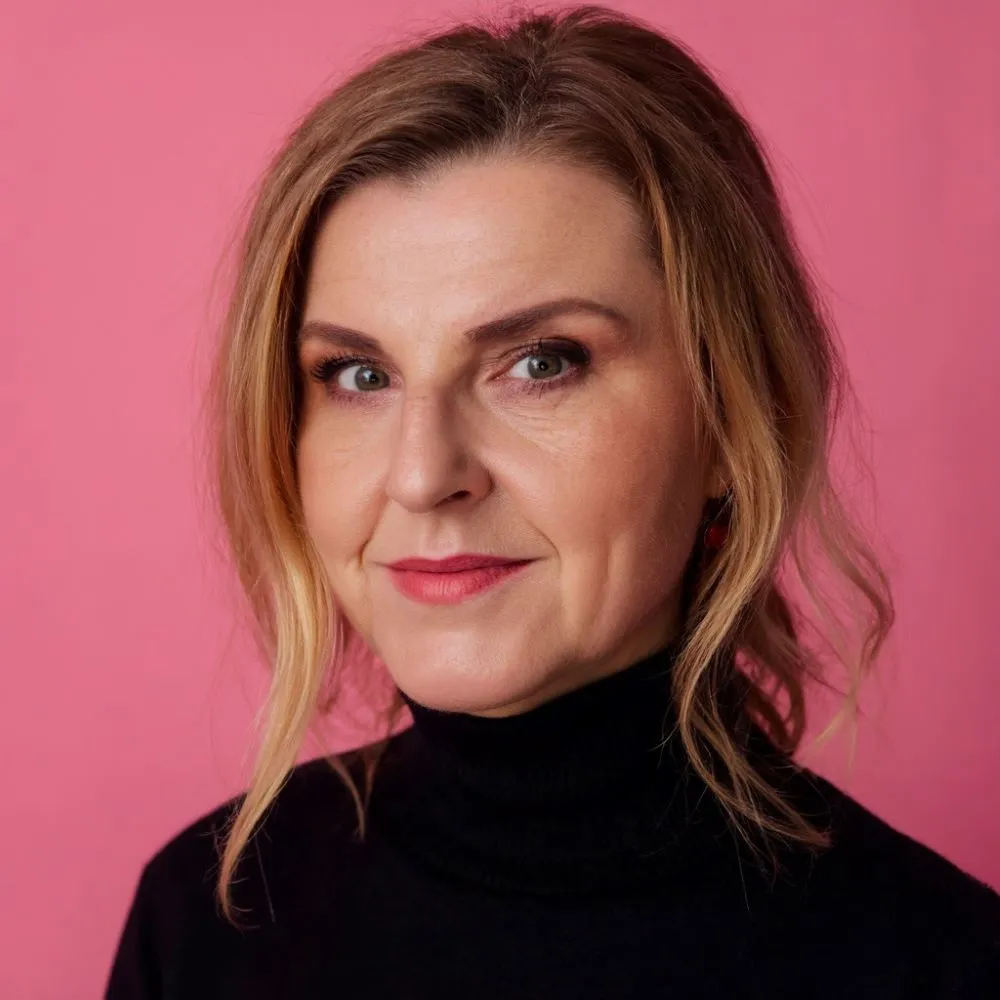 Photo headshot of young female professor with blond hair