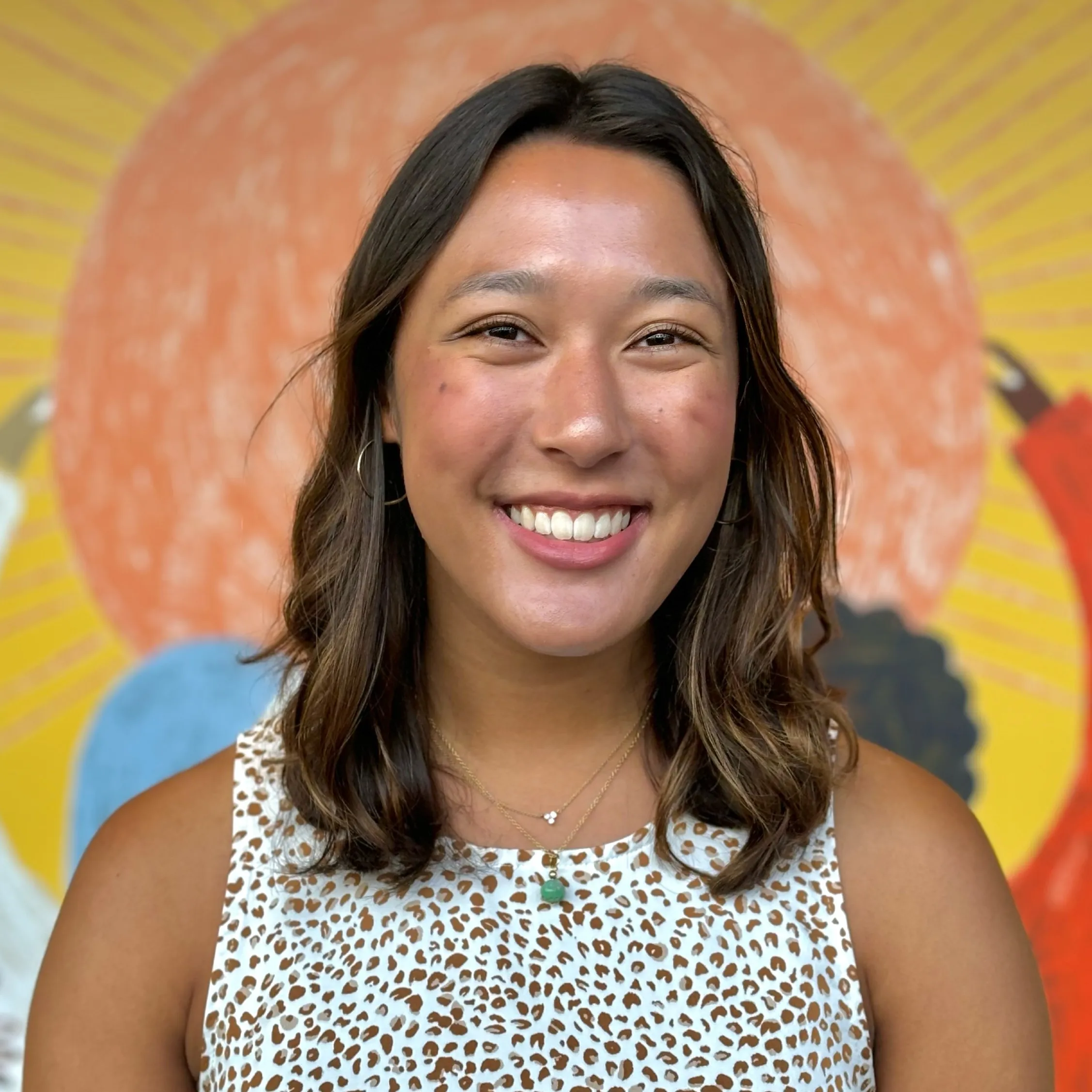Young woman with shoulder length, hair smiling 