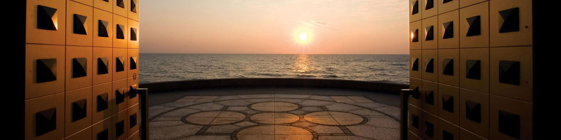 Madonna Della Strada doors open to a sunset over Lake Michigan
