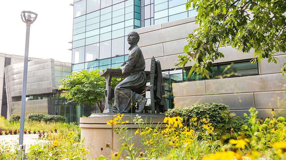 Stritch School of Medicine view of St. Ignatius statue beside Loyola University Chicago building. Stritch School of Medicine view of St. Ignatius statue beside Loyola University Chicago building.