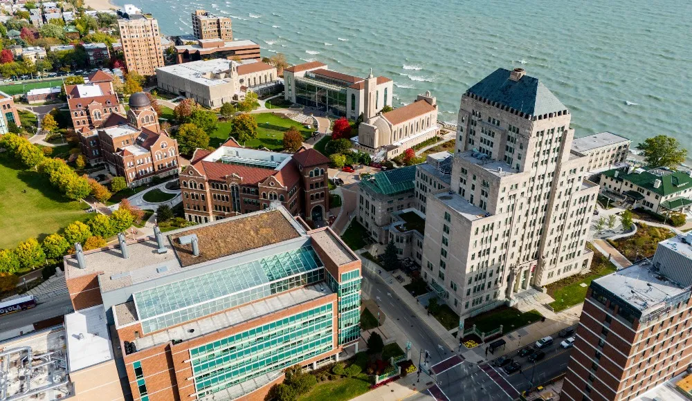 An aerial view of Lake Shore Campus and Lake Michigan, looking north from the south end of campus.