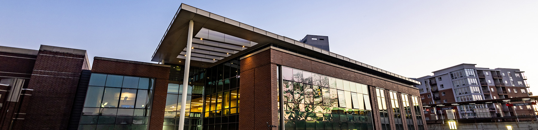The exterior of Damen Student Center against the sky at dusk.