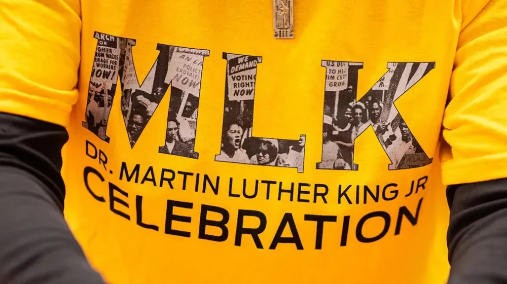 A close-up of a volunteer's shirt that says 