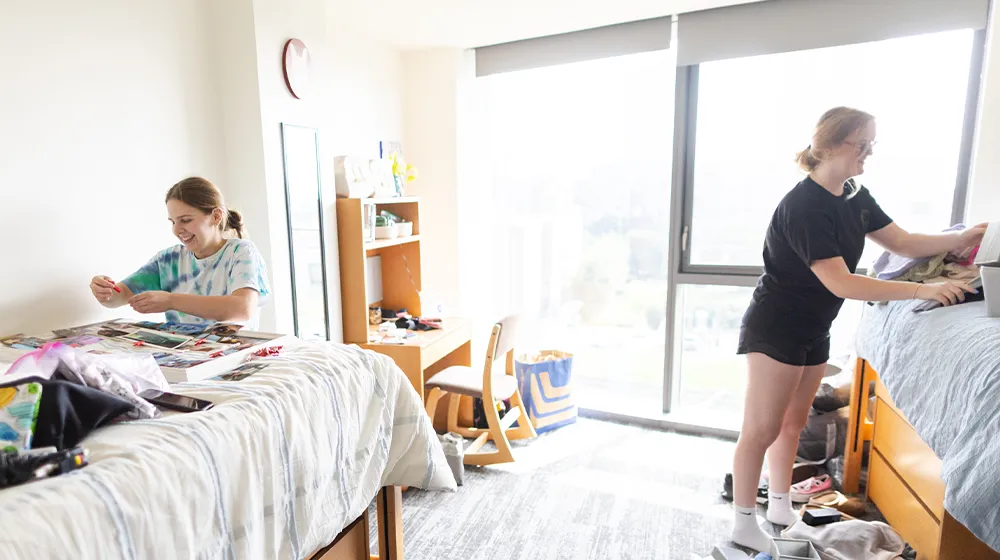 Students unpack in their dorm room during move-in. Students unpack in their dorm room during move-in.