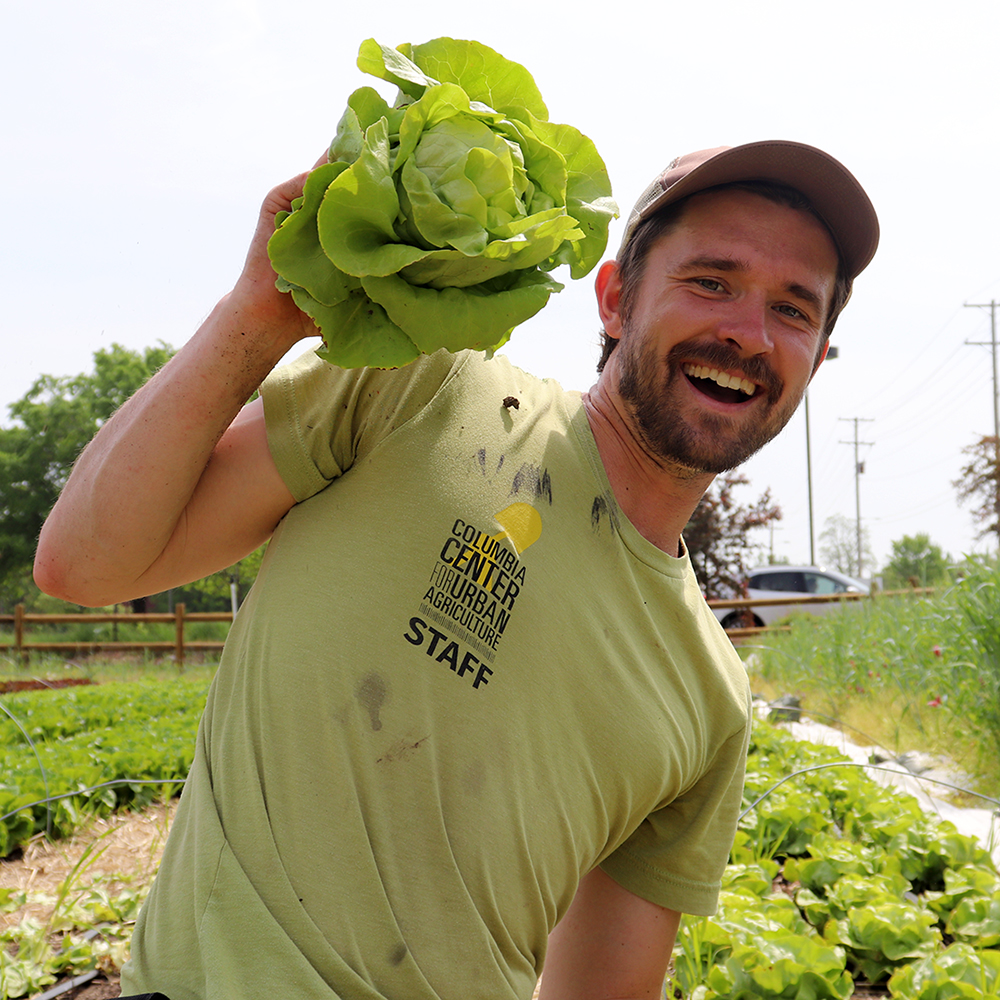 Tony Minnick holding lettuce