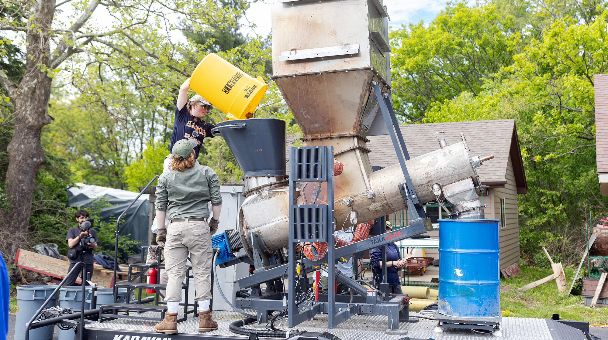 students using biochar equipment