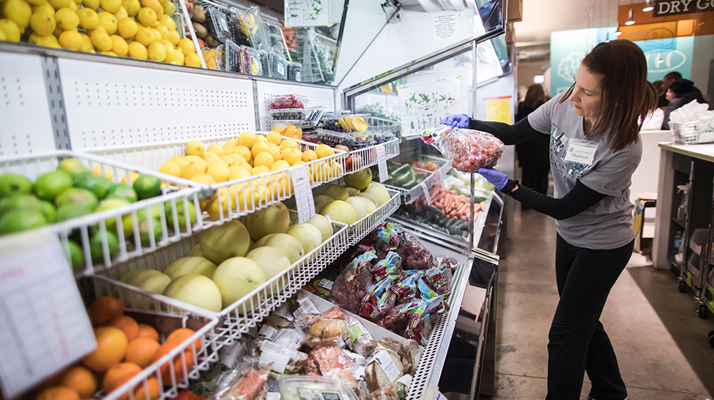 volunteer working in a food pantry