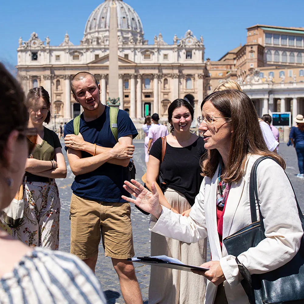 A Loyola University Chicago John Felice Rome Center professor teaches a group of students at an open plaza in Rome. A Loyola University Chicago John Felice Rome Center professor teaches a group of students at an open plaza in Rome.