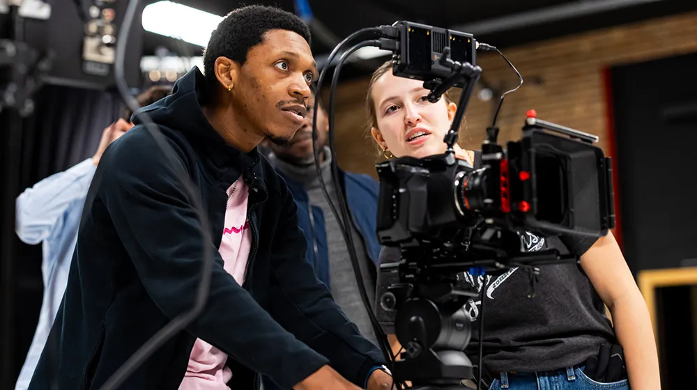 Two Loyola students gain on-set experience as they film in a studio