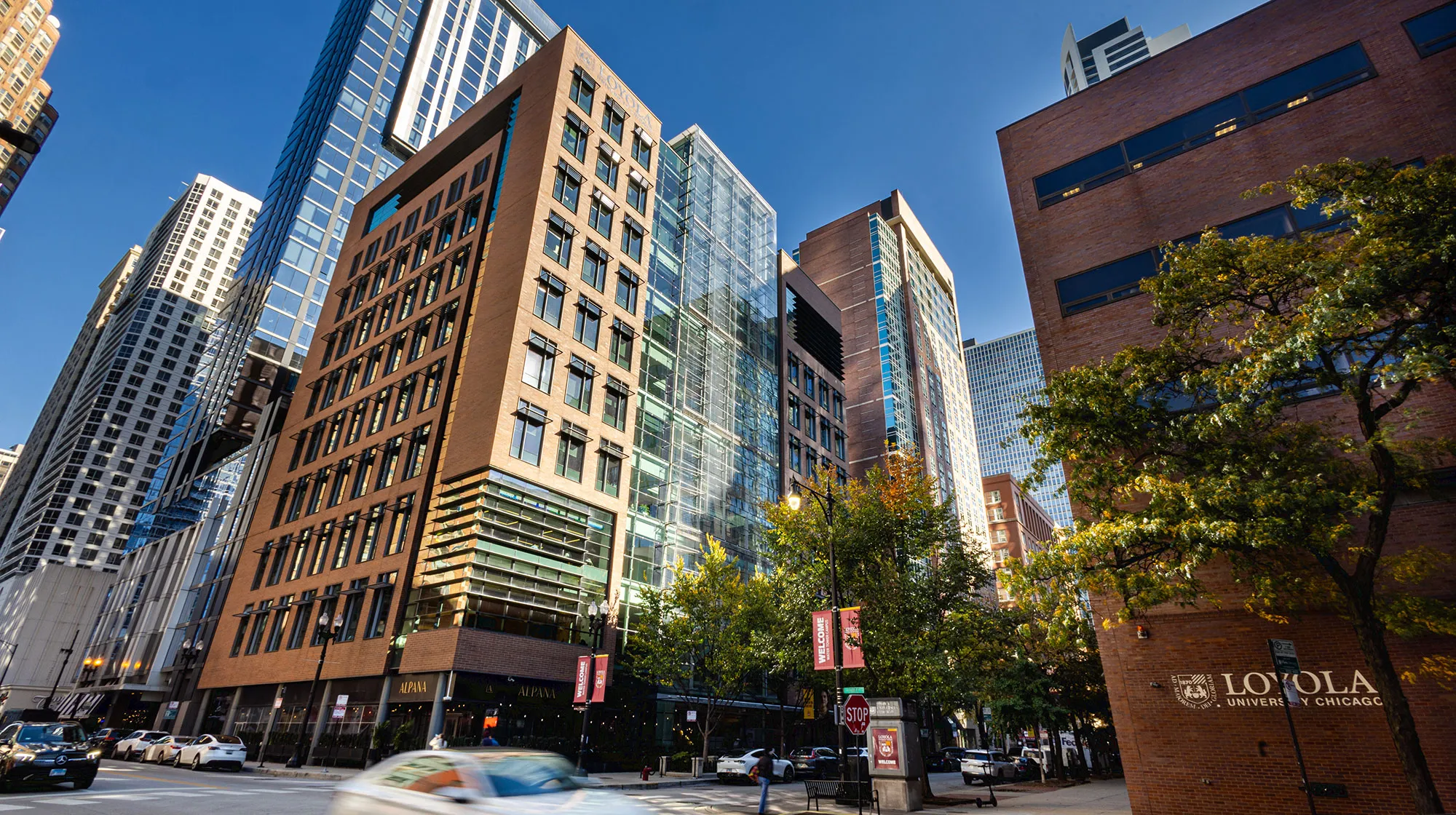 Loyola University Chicago's Water Tower campus buildings rise against a blue sky. Loyola University Chicago's Water Tower campus buildings rise against a blue sky.