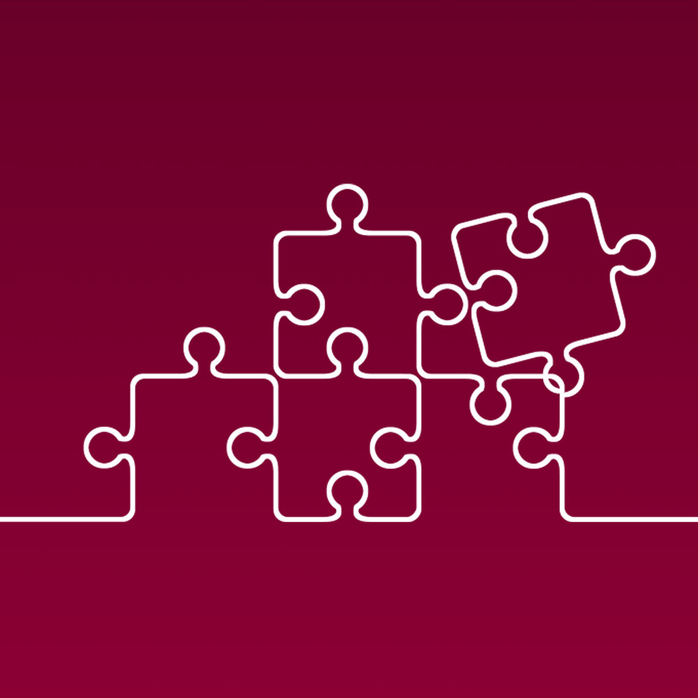 White line illustration of jigsaw puzzle pieces, against a maroon background, to represent Loyola's marketing and communication project management. White line illustration of jigsaw puzzle pieces, against a maroon background, to represent Loyola's marketing and communication project management.