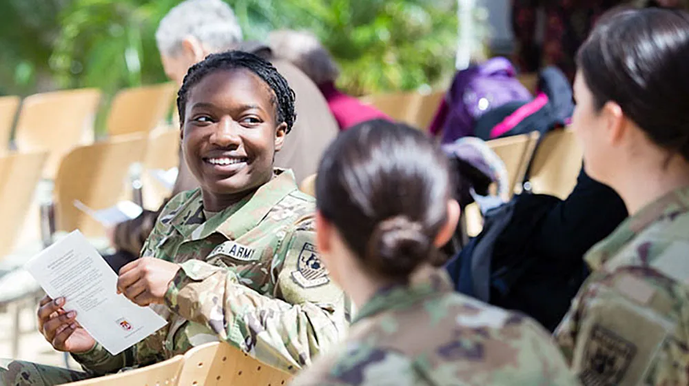 Veterans, members of the military service, and ROTC members interact at Loyola University Chicago. Veterans, members of the military service, and ROTC members interact at Loyola University Chicago.