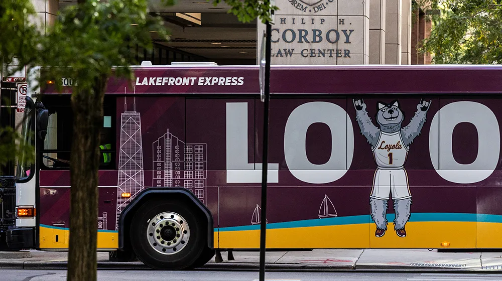 The Loyola campus shuttle. Large letters of The Loyola campus shuttle. Large letters of