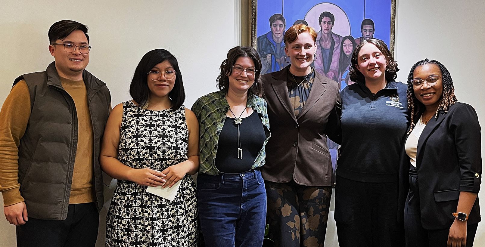 A small group of Womens Studies and Gender Studies graduates pose together in cap and gown attire. A small group of Womens Studies and Gender Studies graduates pose together in cap and gown attire.