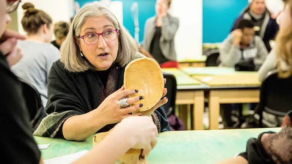 Anne Grauer, PhD holds a part of skeletal remains, an example of crime scene evidence. Anne Grauer, PhD holds a part of skeletal remains, an example of crime scene evidence.