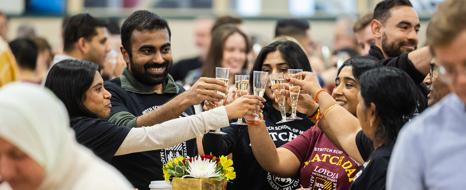 Stritch graduate and family members toasting at Match Day 2025