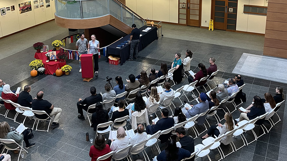 Two students announce an award winners to the audience at Stritch Faculty and Staff Awards 2025