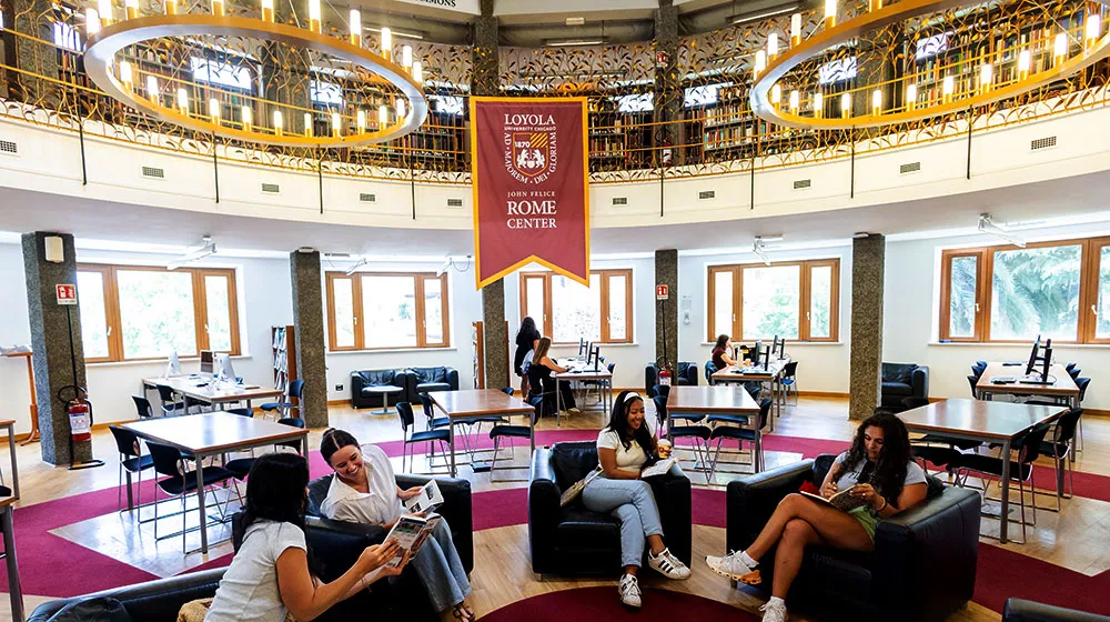 Students study in the John Felice Rome Center Information Commons interior