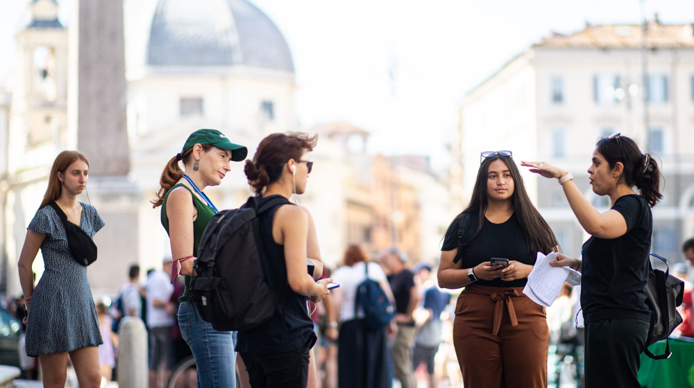 Students gather in an outdoor classroom setting while attending the John Felice Rome campus Students gather in an outdoor classroom setting while attending the John Felice Rome campus
