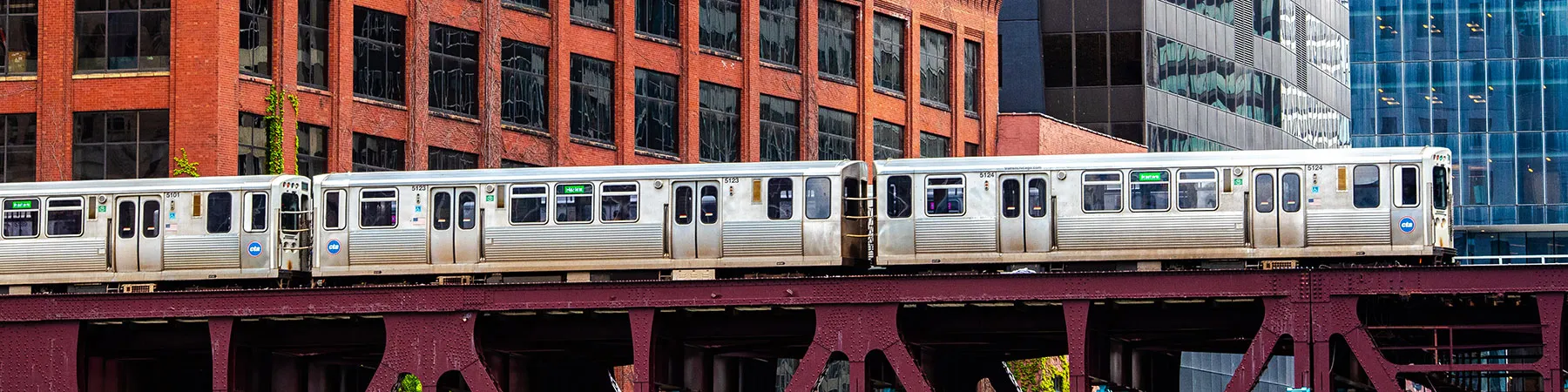 An elevated train in Chicago crossing on a bridge over the Chicago River 