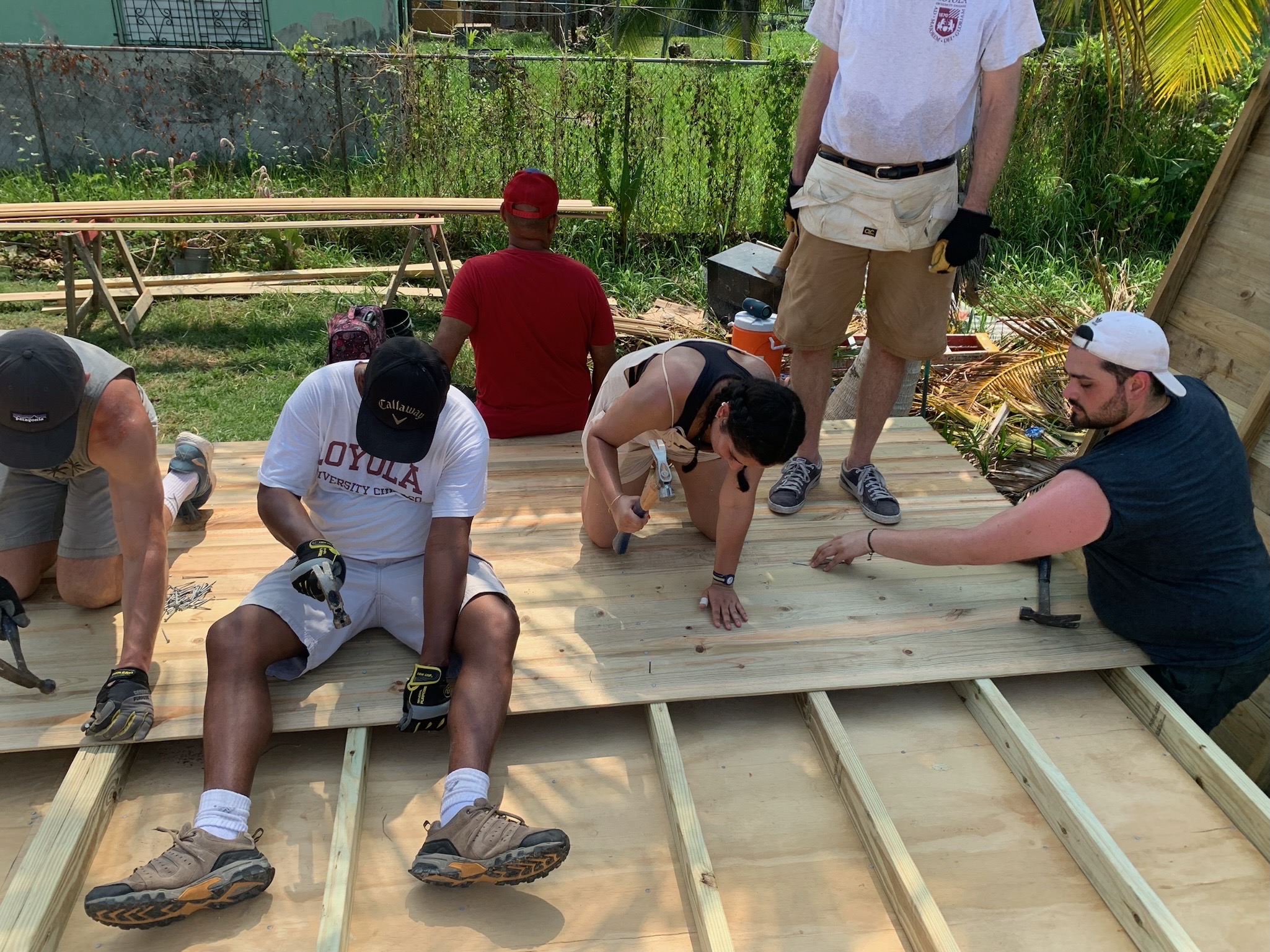 Loyola Health Sciences students and staff building a house in Belize City.