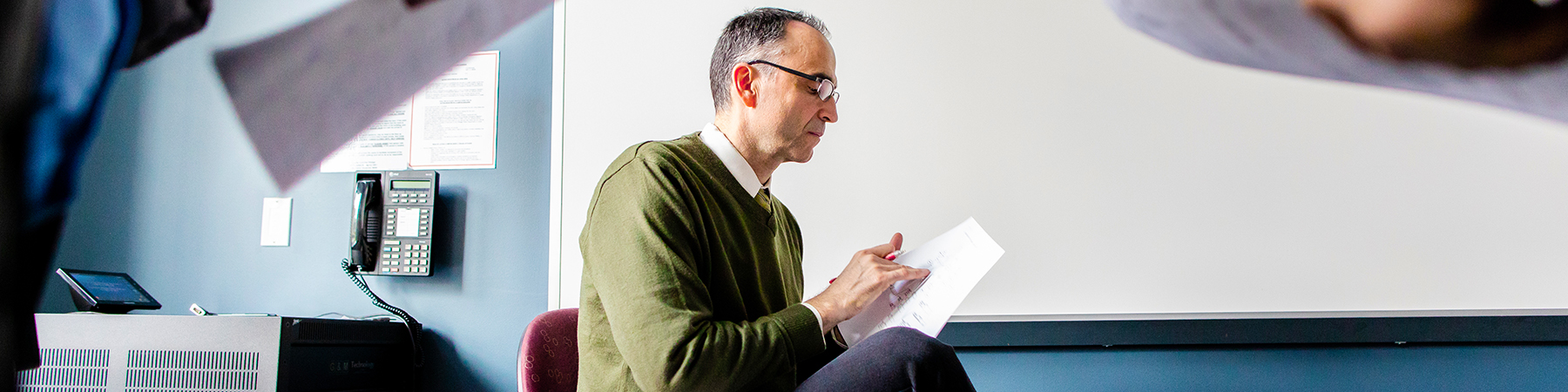 Professor Nenad Jukic teaches students SQL code in his Database and Data Warehousing course