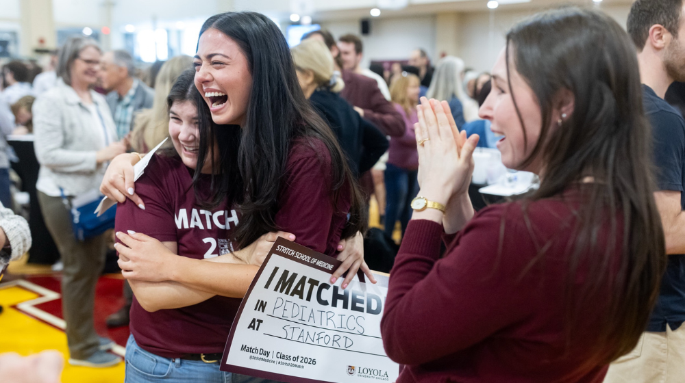 Loyola physicians-in-training react as they receive their residency matches during Loyola University Chicago Stritch School of Medicine's Match Day.