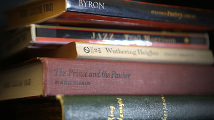 Stack of classic books including Wuthering Heights and The Prince and the Pauper.