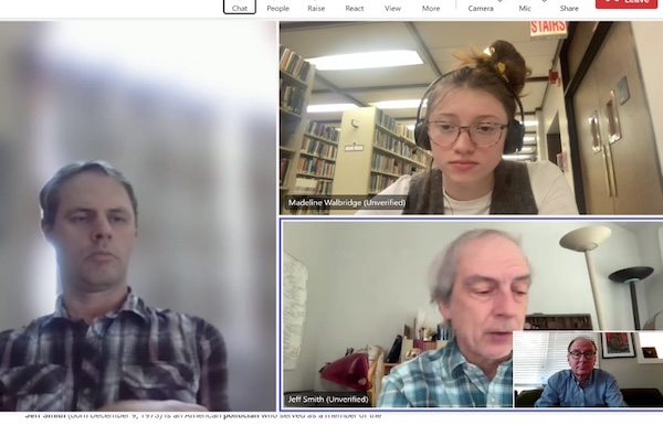 Three people in a virtual meeting grid during an online video call.