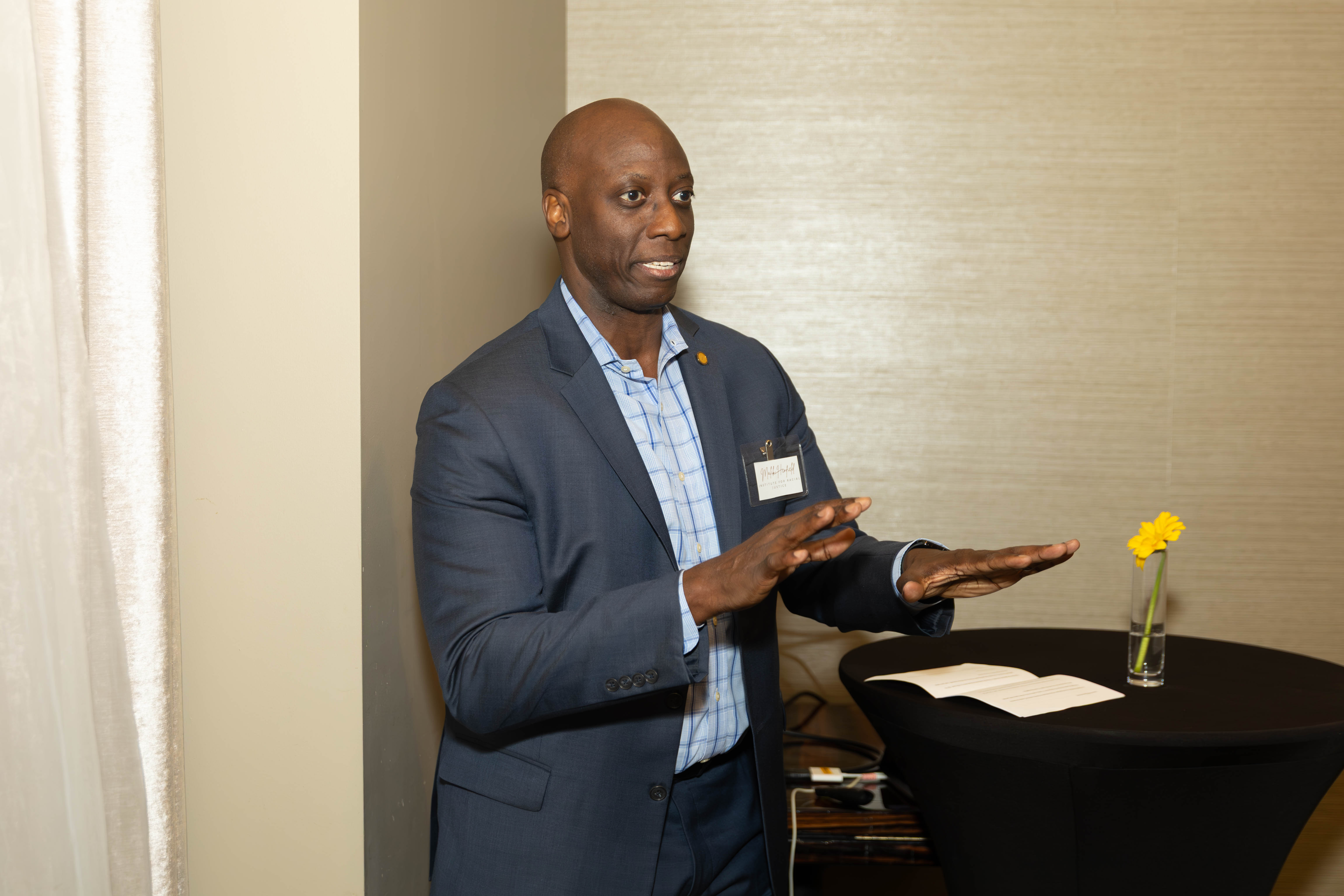 Person speaks during indoor meeting or training session setting. Person speaks during indoor meeting or training session setting.