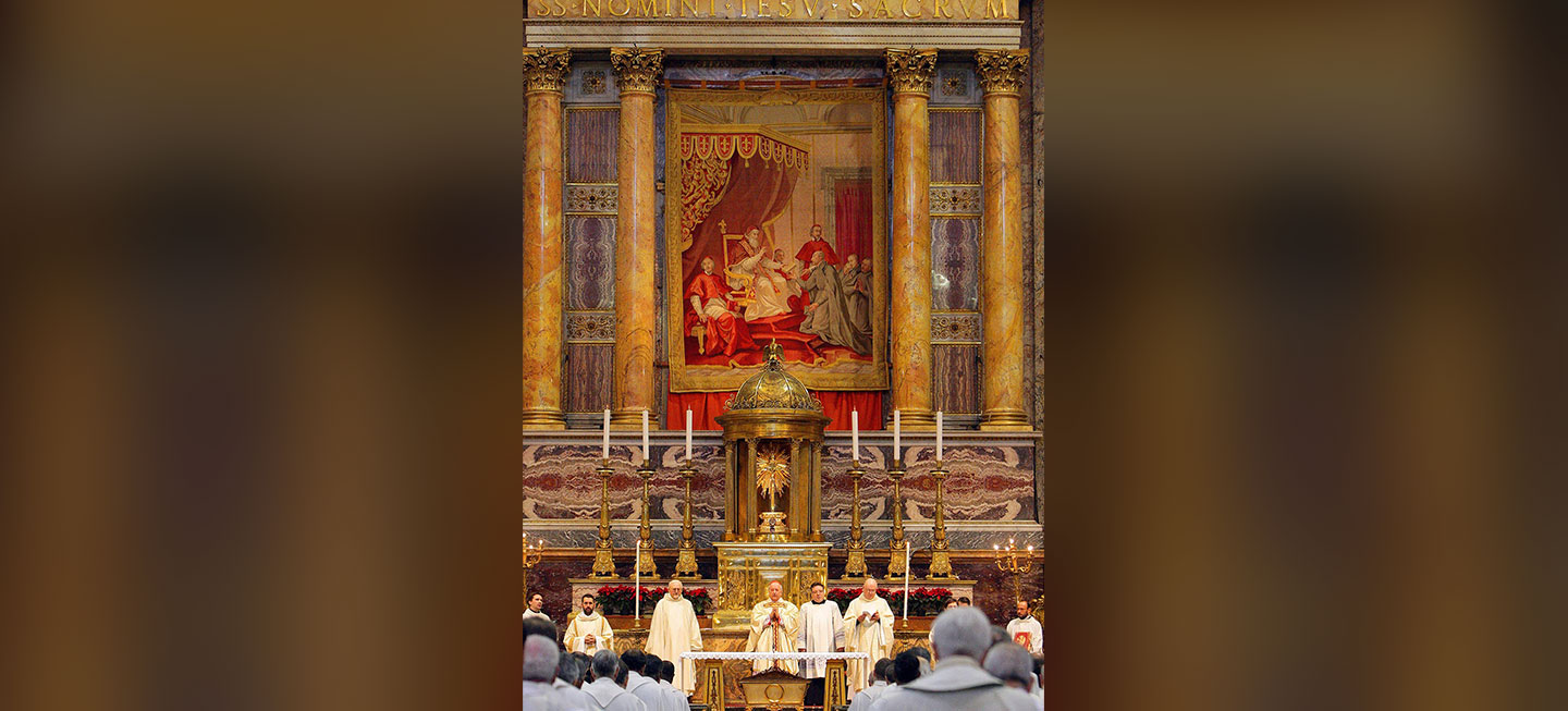 Several Jesuits standing behind an alter.