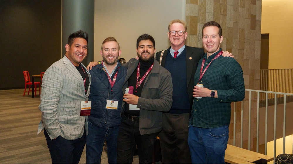 Alumni mingle at a JFRC event.