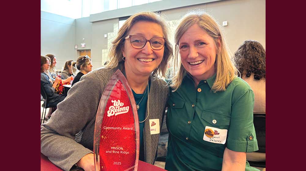Clinical Assistant Professors pose for photo together with award