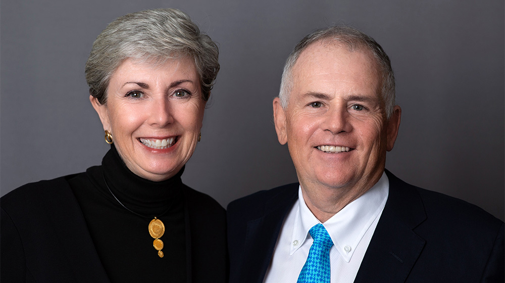 Rocco and Roxanne Martino in front of a gray background