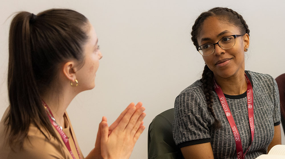 Feedback & Coaching for Performance Management - Two women in conversation